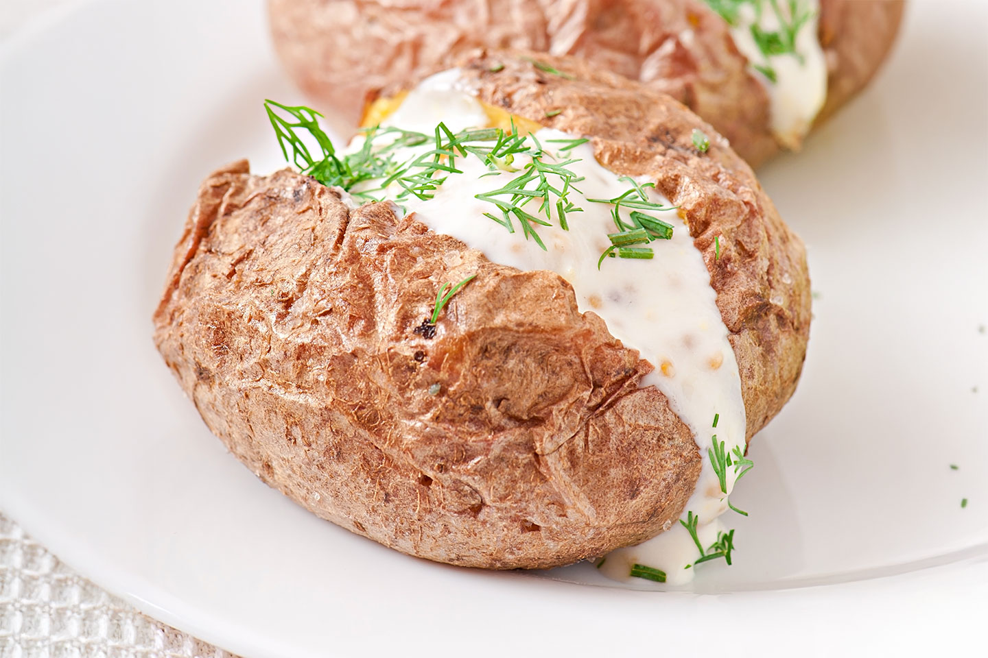 Bakad potatis och dryck hos Graffiti Café i Västra Hamnen